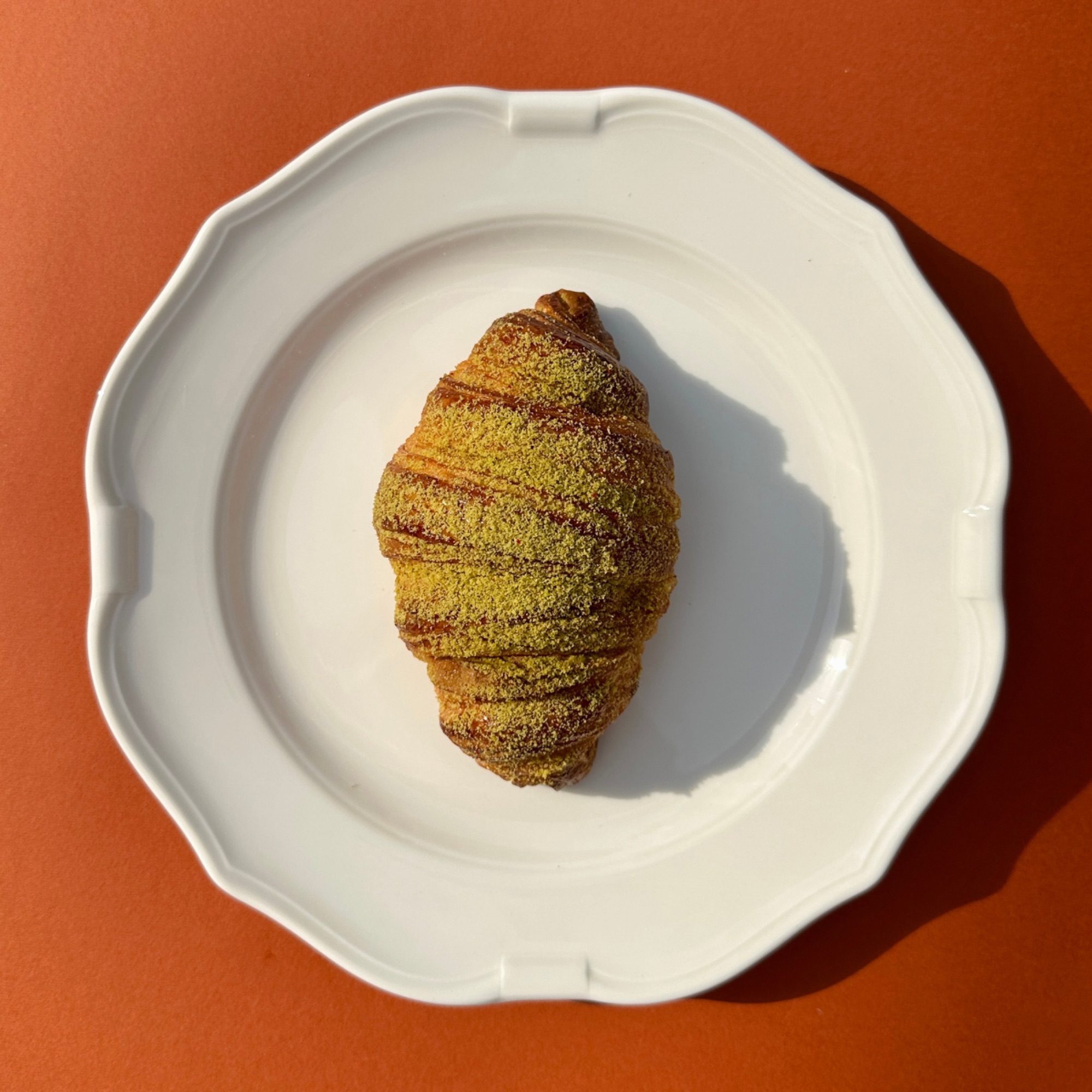 Pistachio croissant with raspberries